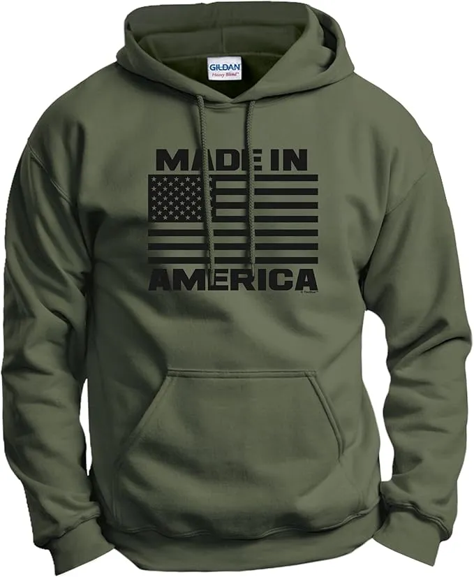 An olive green heavy-blend hoodie featuring a bold black graphic of the American flag with the words "MADE IN AMERICA" integrated into the design.