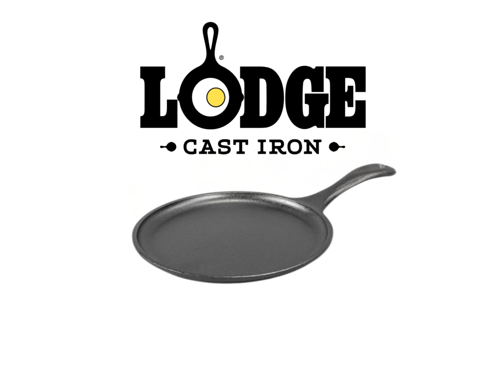 A round black cast iron griddle with a short curved handle on a white background.