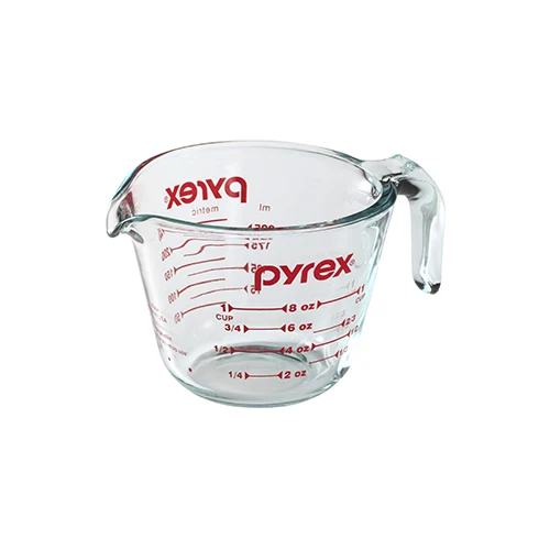 Pyrex 1-cup clear tempered glass measuring cup with red markings and sturdy handle.